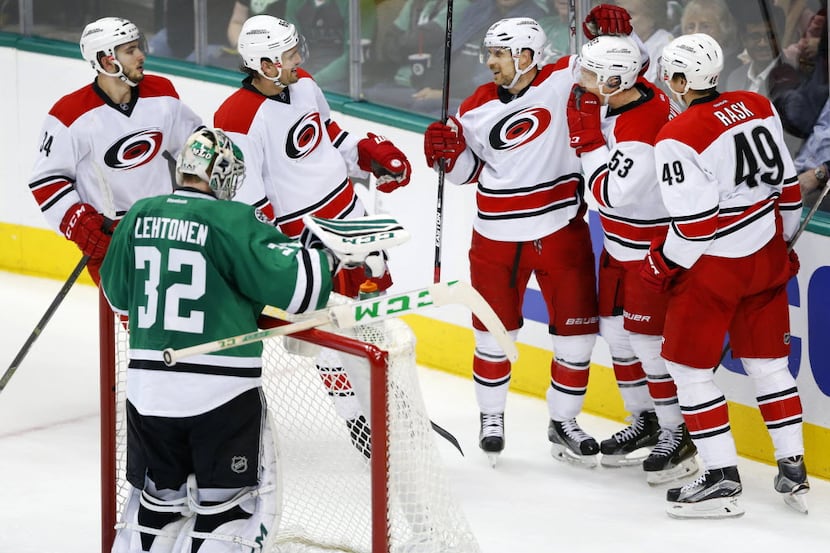 Carolina Hurricanes players congratulate left wing Jeff Skinner (53) on his game typing goal...