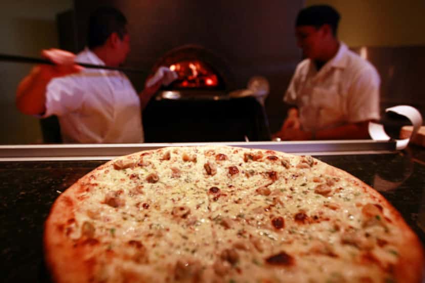 At Nonna, a Roman-style white pizza features cherrystone clams, sweet onion and fresh herbs.