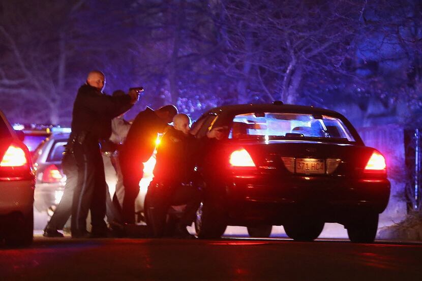 Police search for a suspect in Watertown, Mass. Earlier, a Massachusetts Institute of...