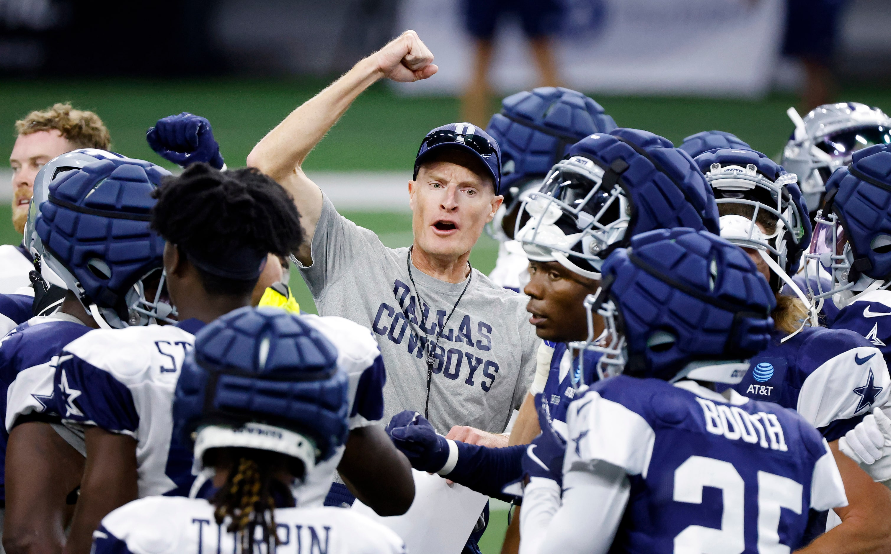 Dallas Cowboys special teams coach John Fassel breaks the huddle following a training camp...