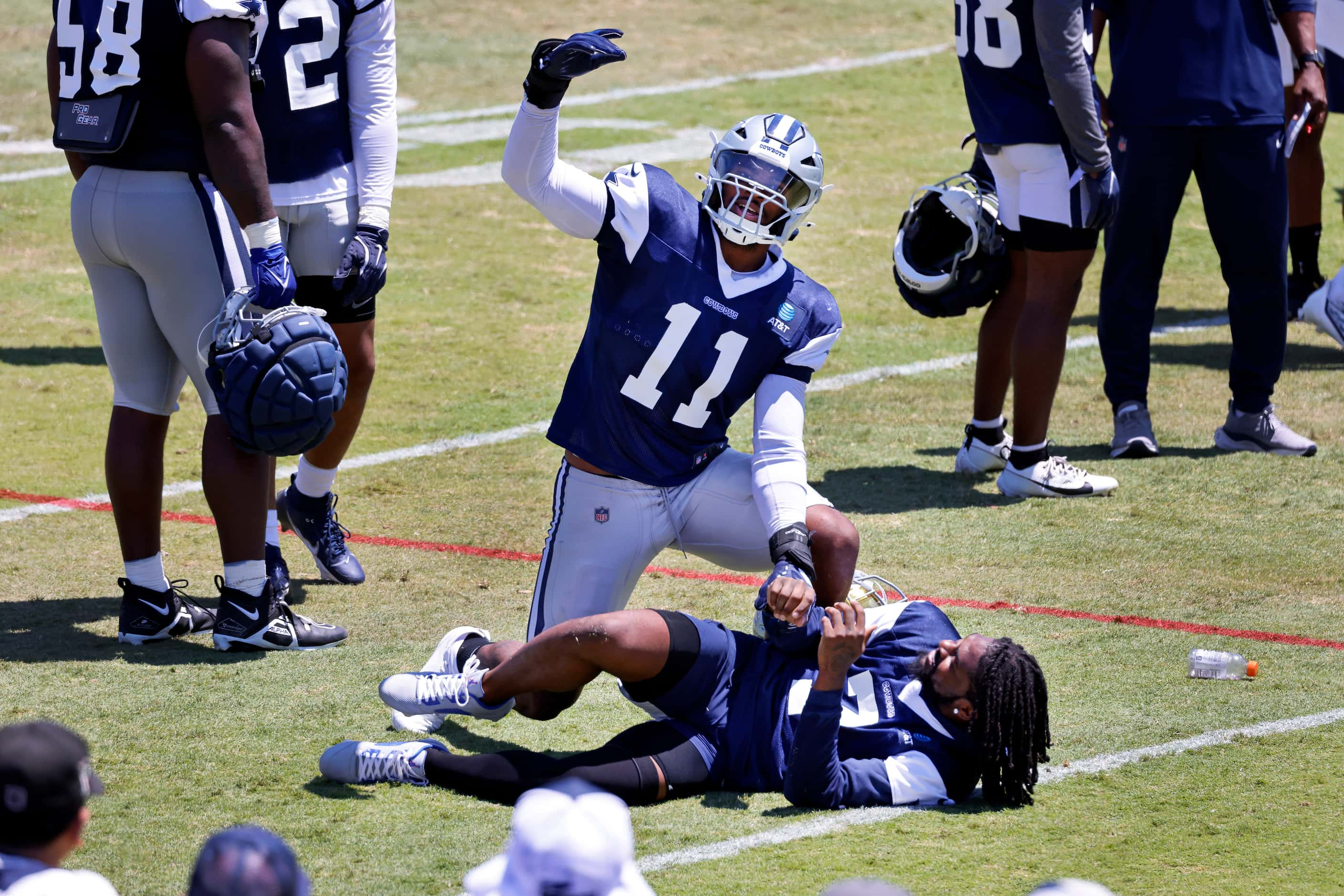 Dallas Cowboys linebacker Micah Parsons (11) encourages the fans to cheer after dropping on...