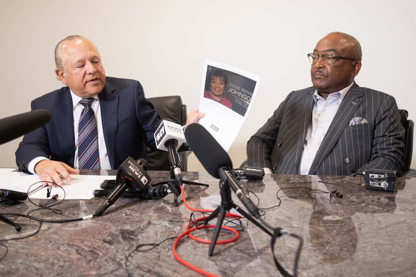 Attorney Les Weisbrod, left, holds a page about the Eddie Bernice Johnson Lives Foundation...