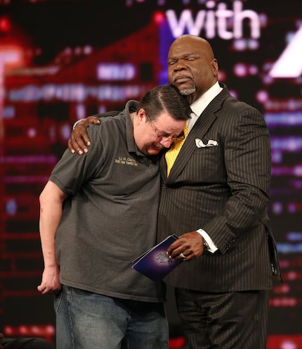 In this 2016 file photo, Dallas County Sheriff's Lt. Steven Gentry is hugged by Bishop T.D....