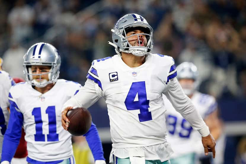 Dallas Cowboys quarterback Dak Prescott (4) celebrates his fourth quarter touchdown run...