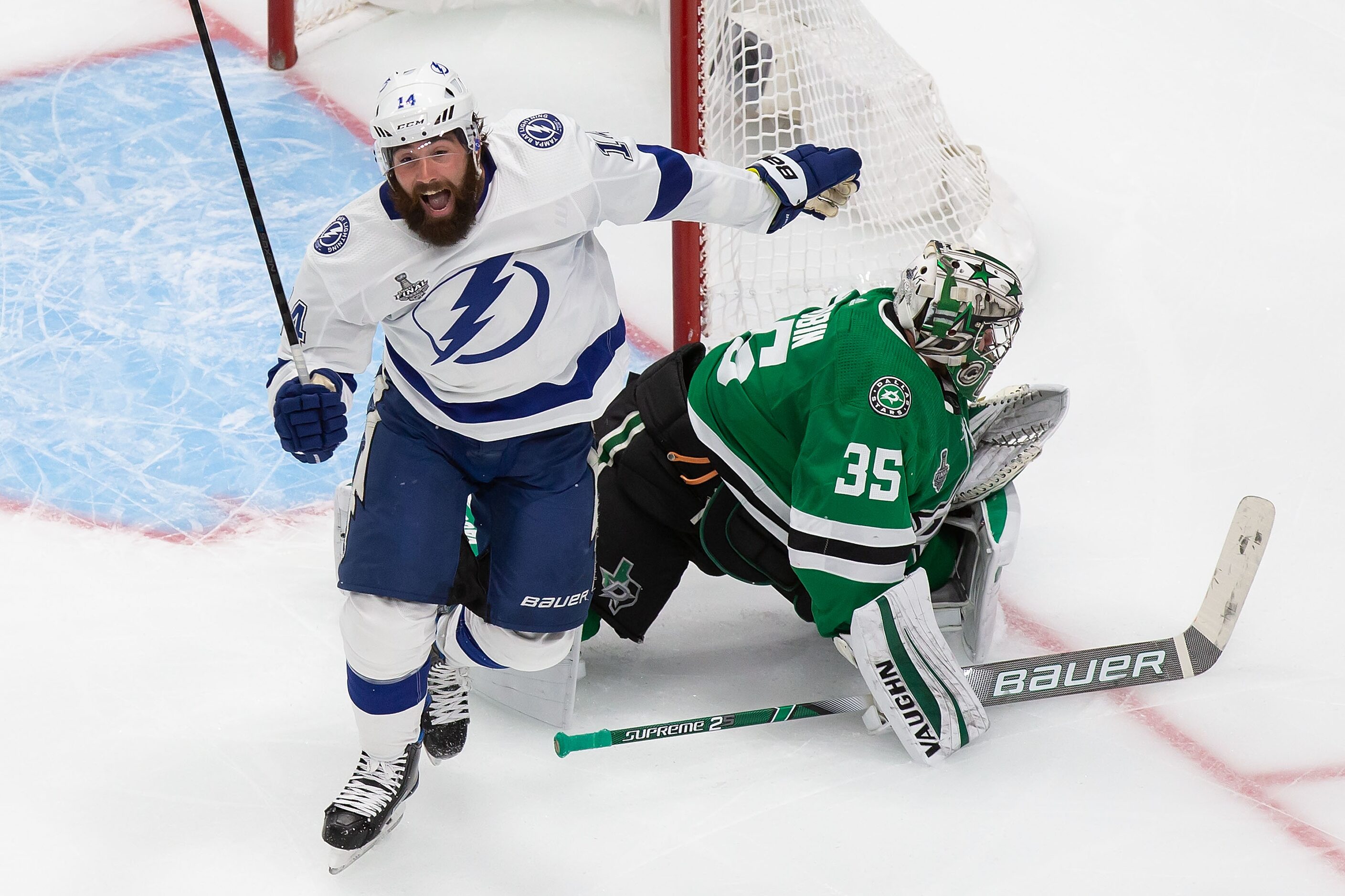 Goaltender Anton Khudobin (35) of the Dallas Stars and Pat Maroon (14) of the Tampa Bay...