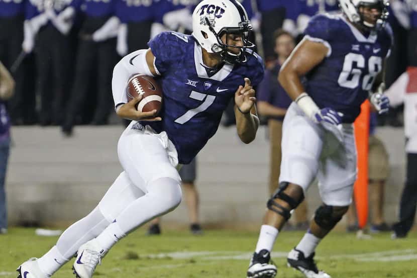 TCU quarterback Kenny Hill (7) keeps the ball, running it in for a second-quarter touchdown...