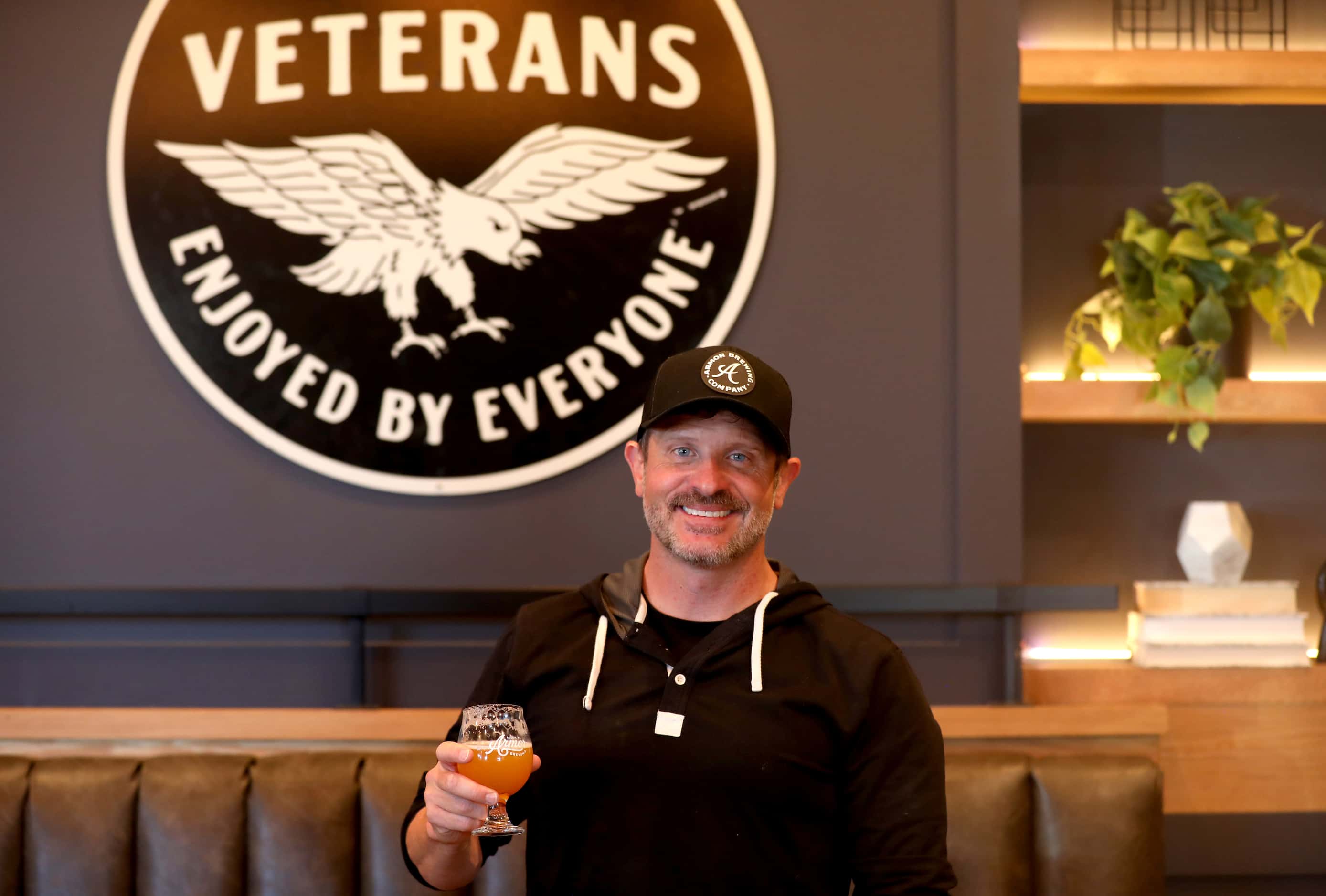 Owner Mike Todryk poses at Armor Brewing Company in Allen, Texas, Thursday, October 19,...