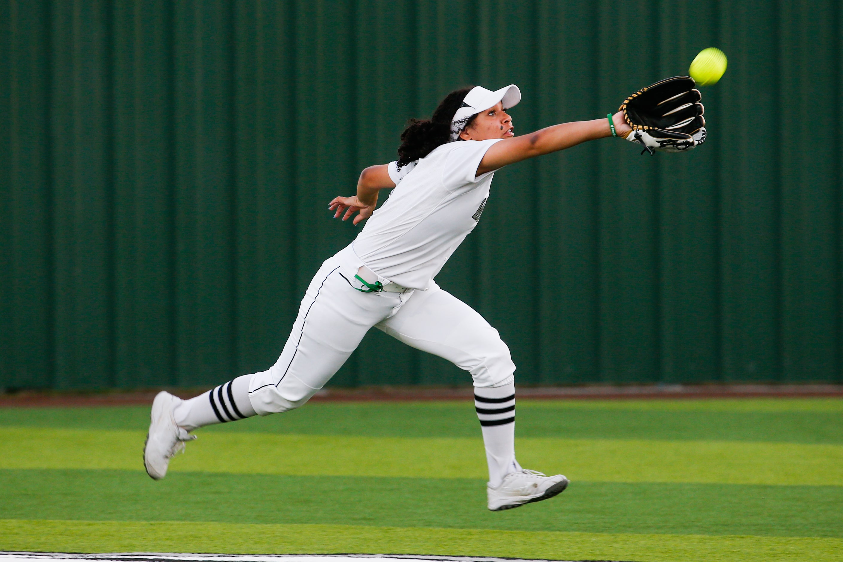 Denton Guyer's Tehya Pitts (8) catches a ball in the outfield from Keller during the second...