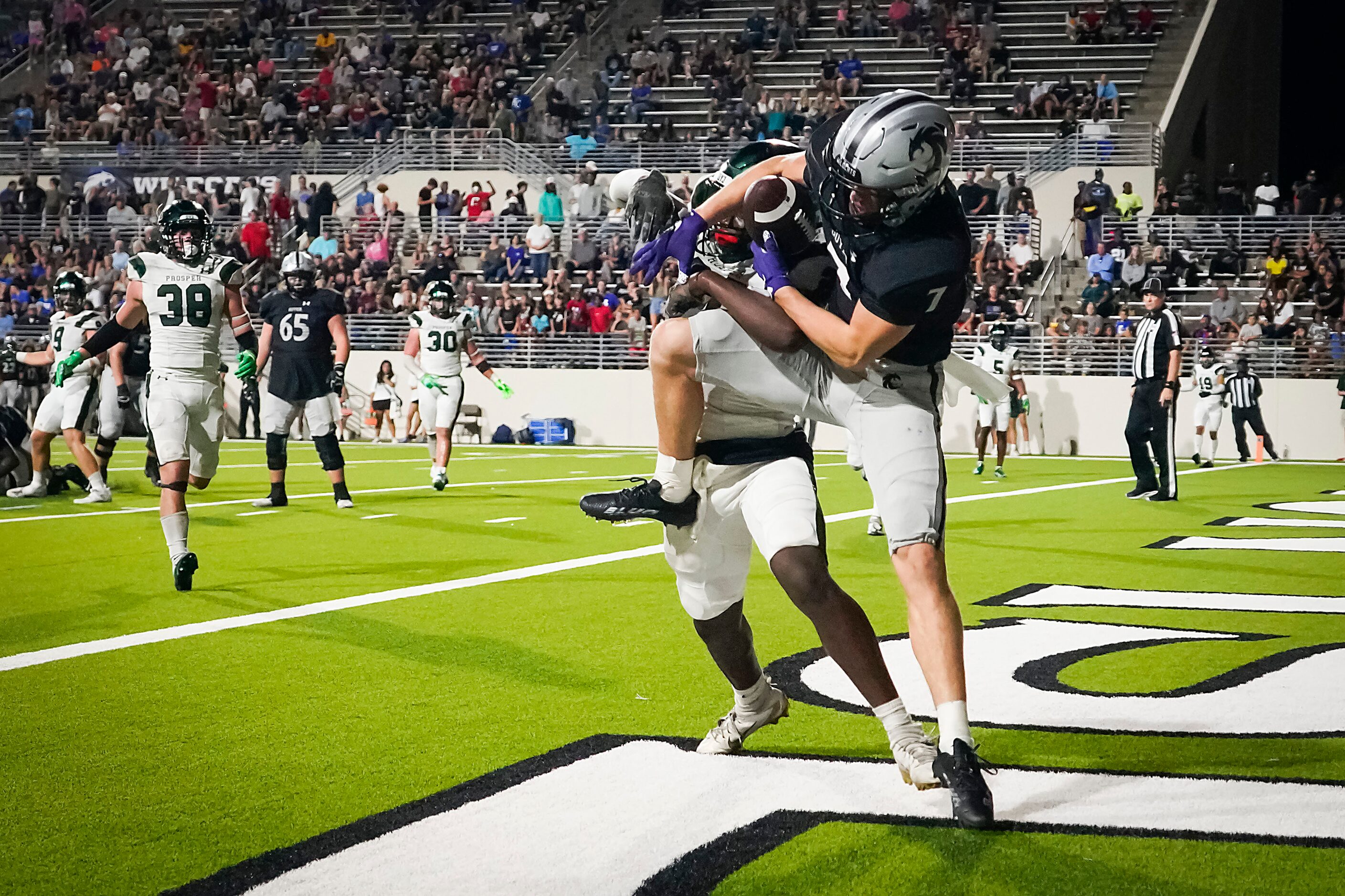 Denton Guyer wide receiver Landon Sides (7) catches a 7-yard touchdown pass past Prosper...