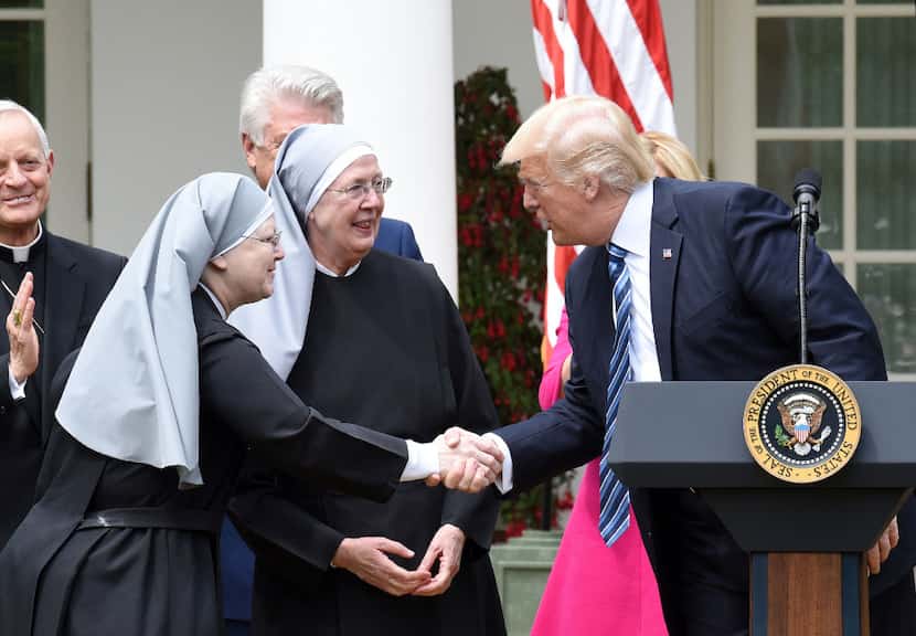 President Donald Trump greets the Little Sisters of the Poor before signing the Executive...