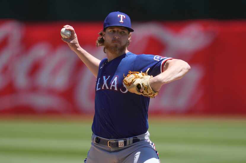 Texas Rangers pitcher Jon Gray works against the Oakland Athletics during the first inning...