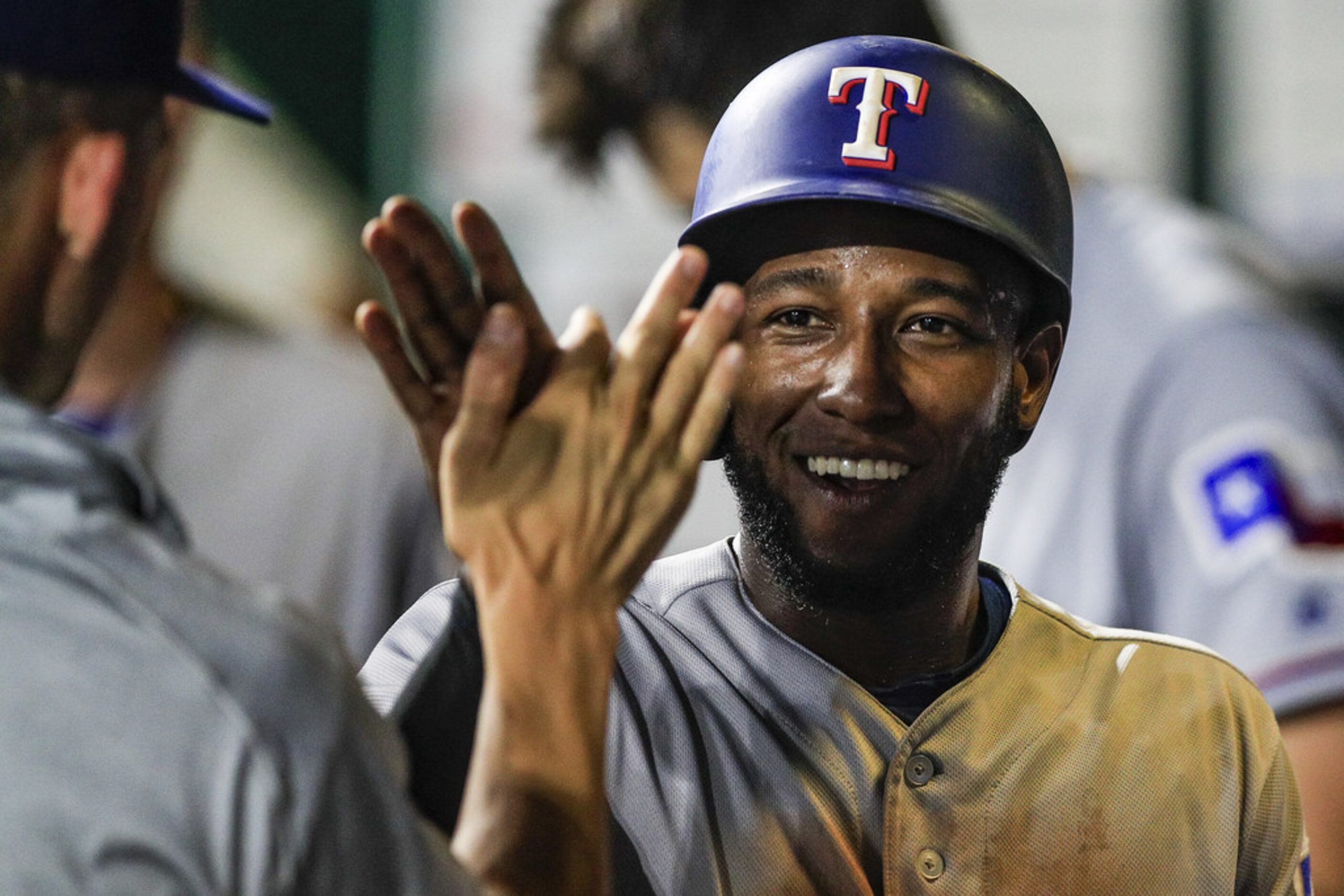 KANSAS CITY, MO - JUNE 18: Jurickson Profar #19 of the Texas Rangers celebrates scoring a...