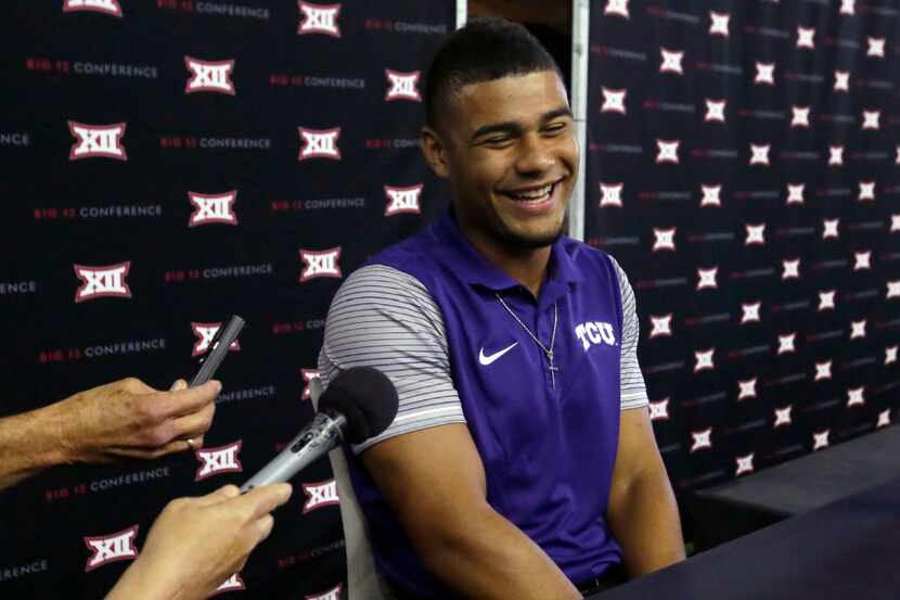 TCU quarterback Kenny Hill laughs while speaking with reporters during the Big 12 NCAA...