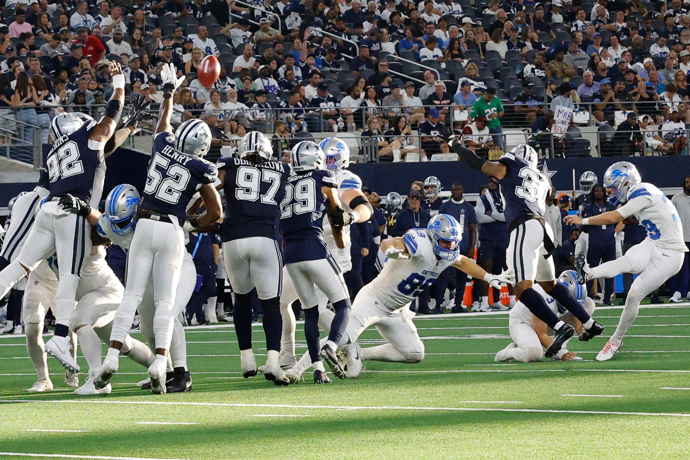 Detroit Lions place kicker Jake Bates (39), far right, scores a field goal against the...