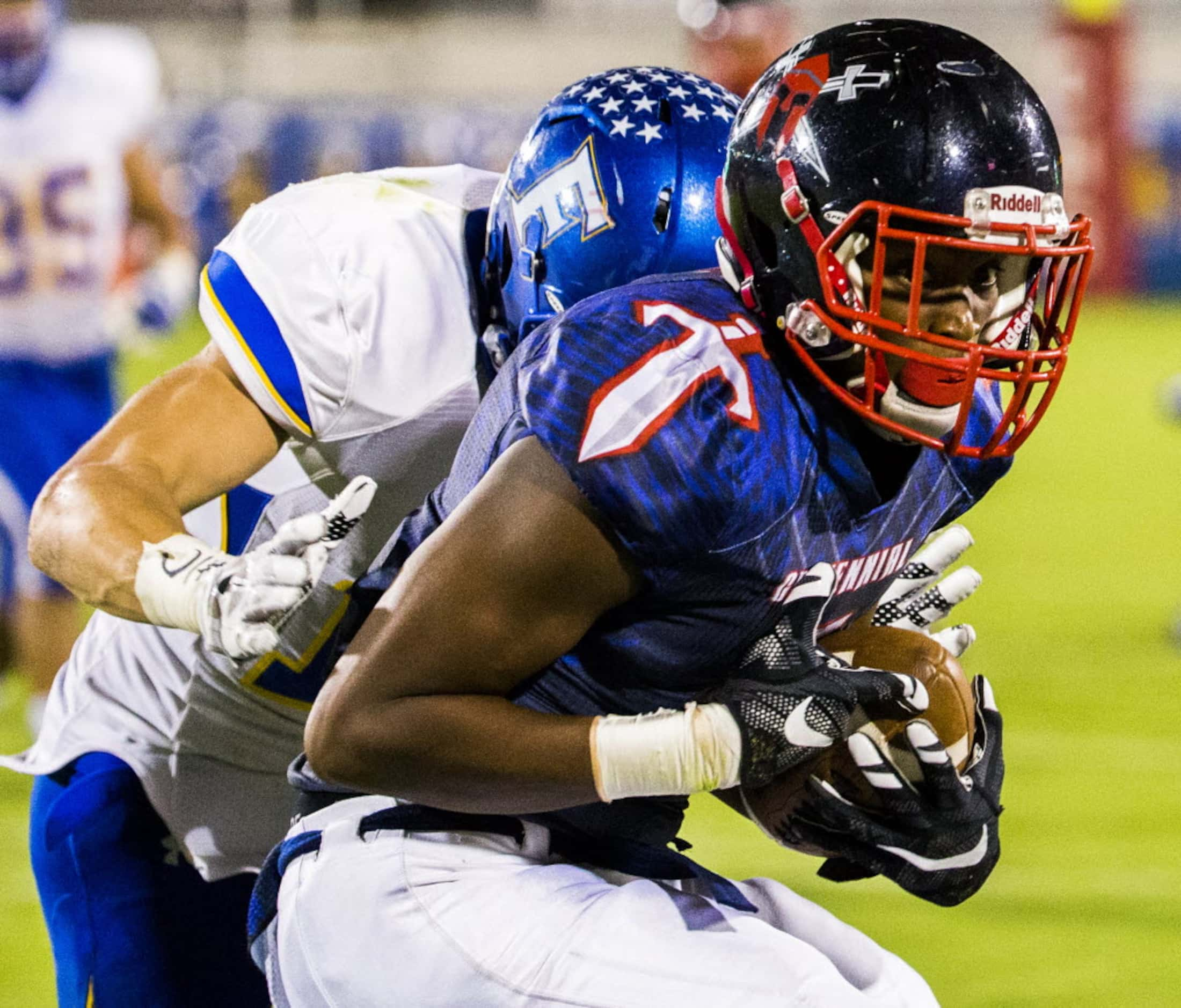 Frisco Centennial wide receiver Kenny Nelson (5) is tackled by Frisco linebacker Grayson...