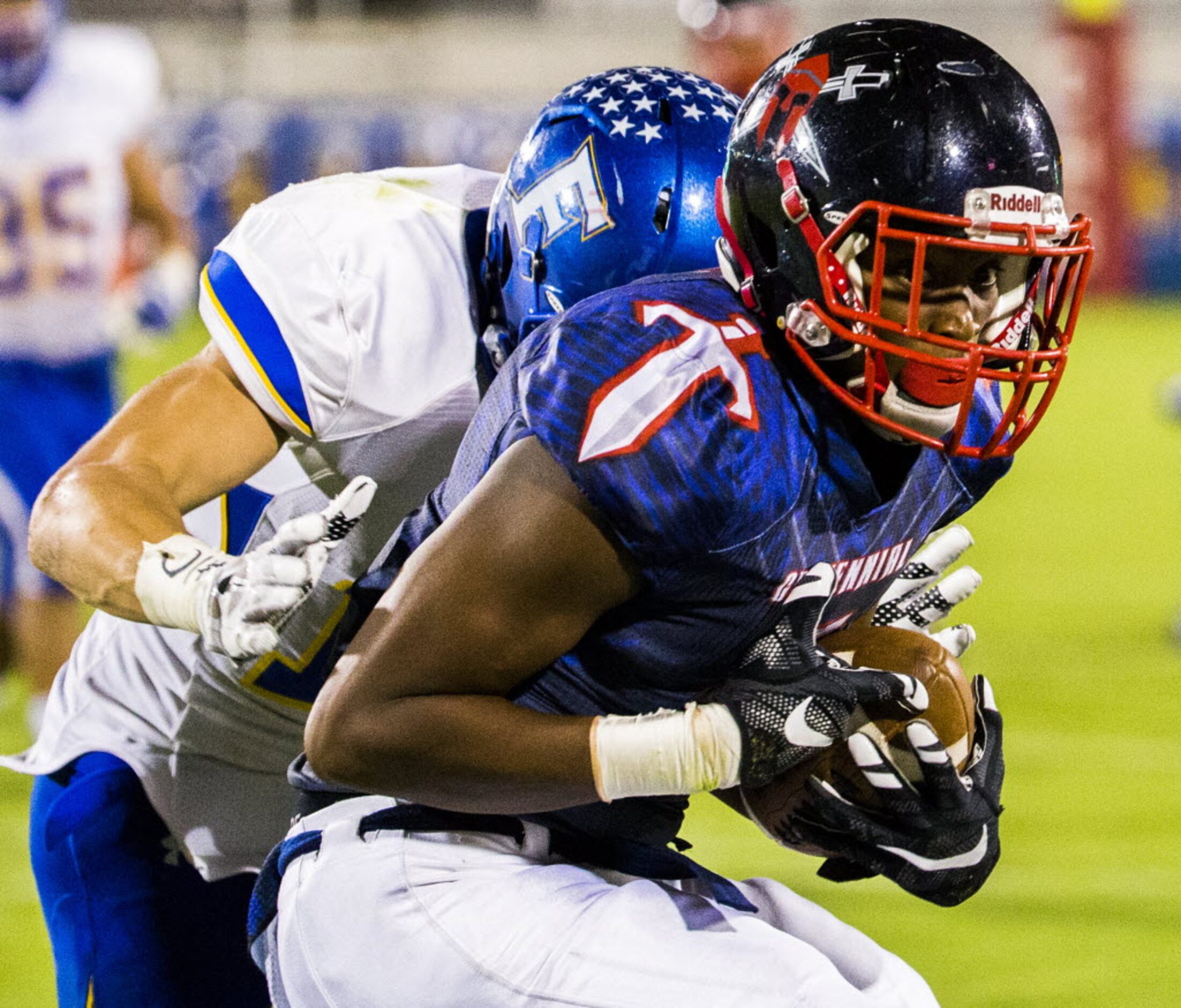 Frisco Centennial wide receiver Kenny Nelson (5) is tackled by Frisco linebacker Grayson...