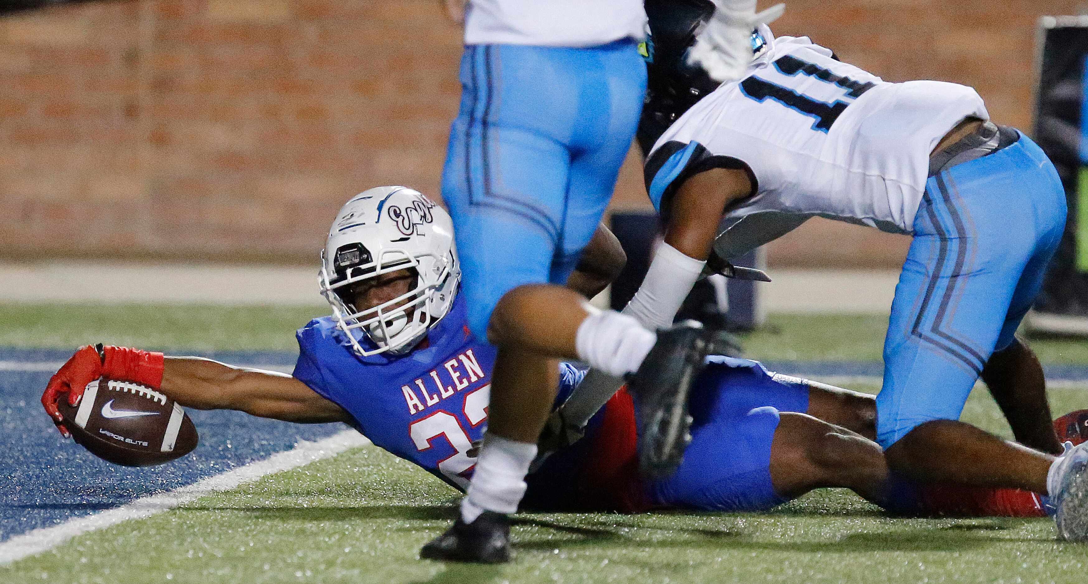 Allen High School running back Micah Ellis (23) breaks the goal line for a score during the...