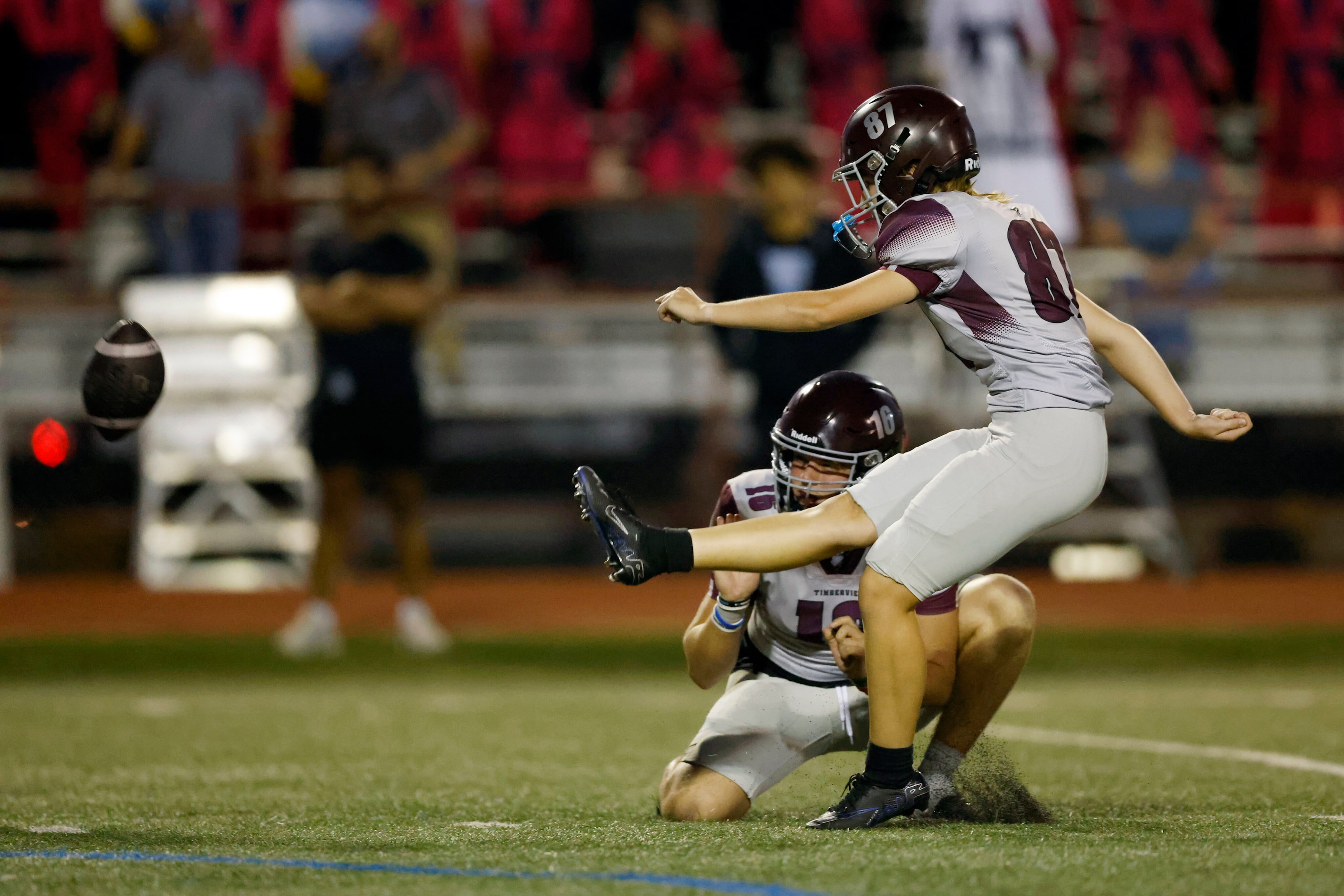 Mansfield Timberview kicker Emma Young (87) kicks a field goal during the first half of a...