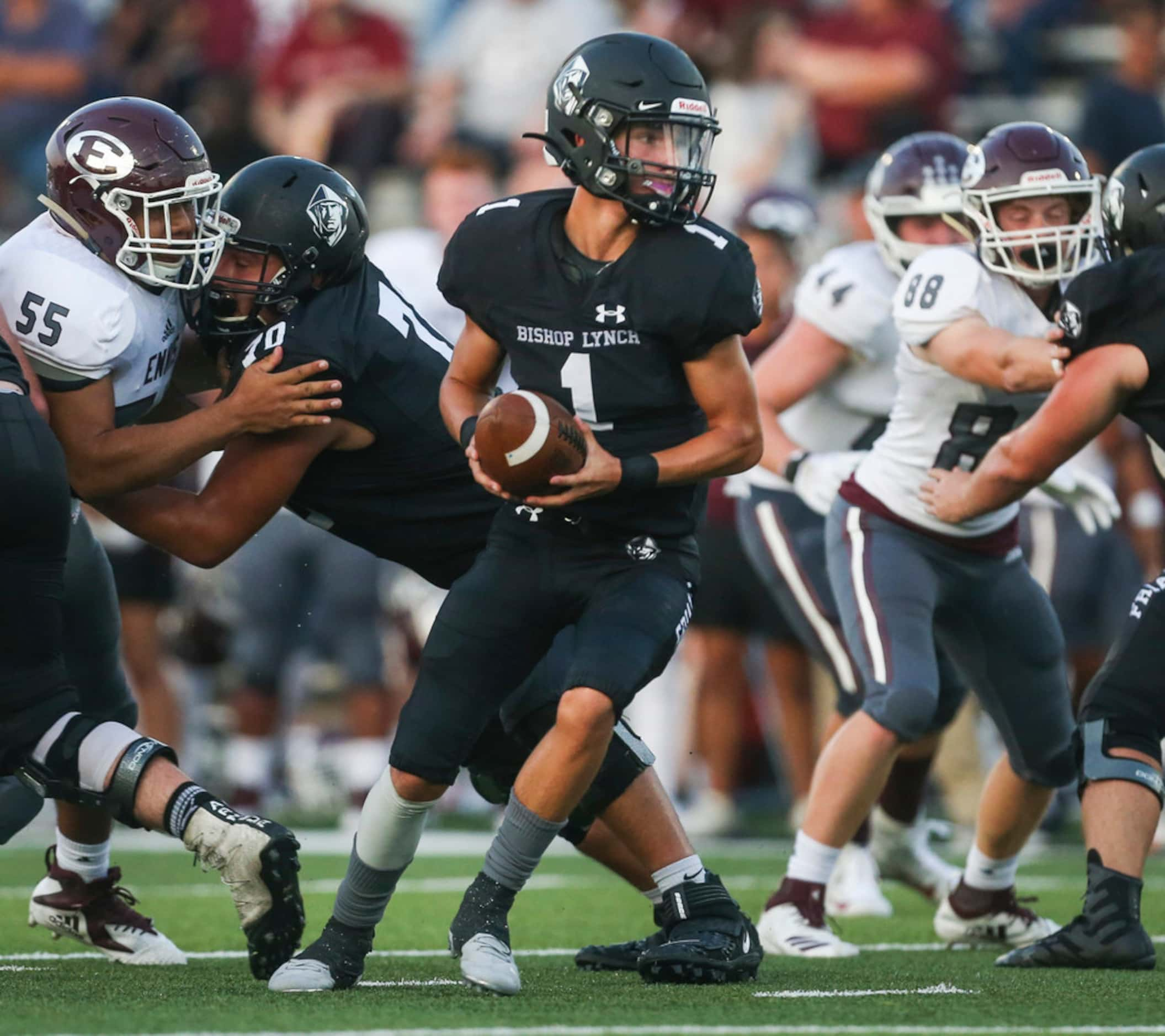 Bishop Lynch quarterback Michael Light (1) looks for a receiver during a high school...