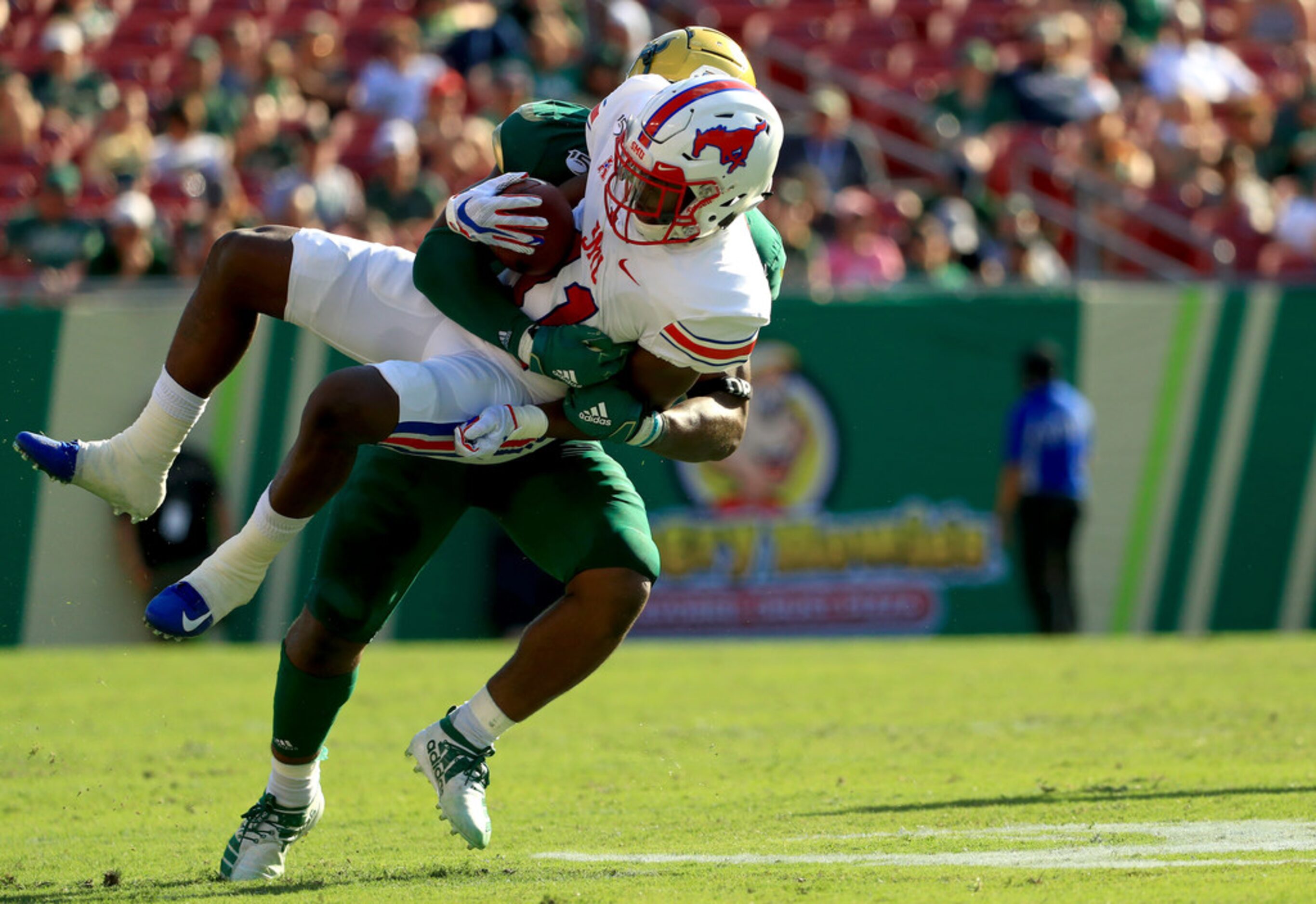 TAMPA, FLORIDA - SEPTEMBER 28: Rashee Rice #11 of the Southern Methodist Mustangs is tackled...