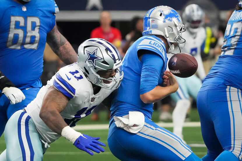 Detroit Lions quarterback Jared Goff (16) fumbles as he is sacked by Dallas Cowboys...
