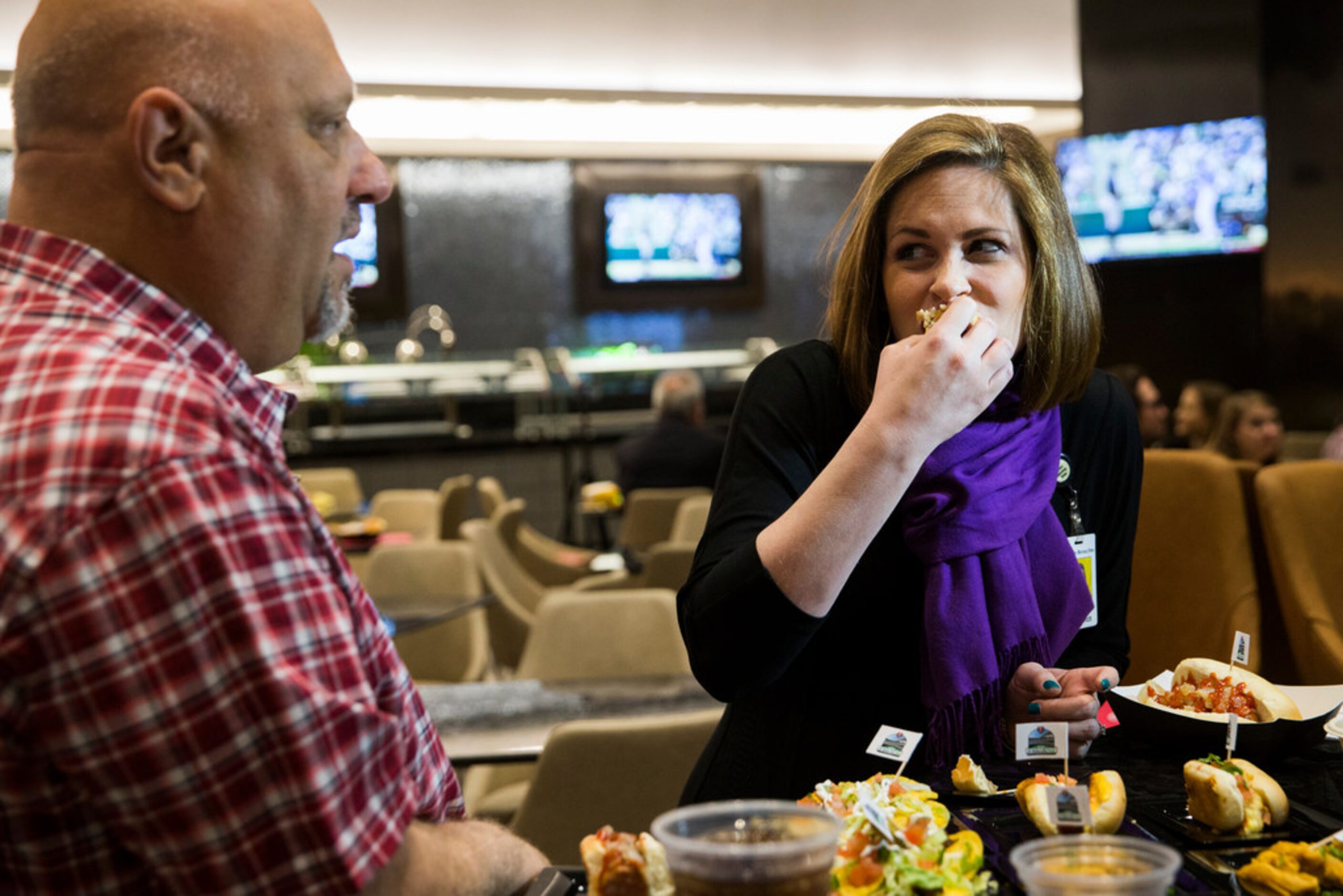 The Dallas Morning News' Evan Grant and Sarah Blaskovich sample new concession stand items...