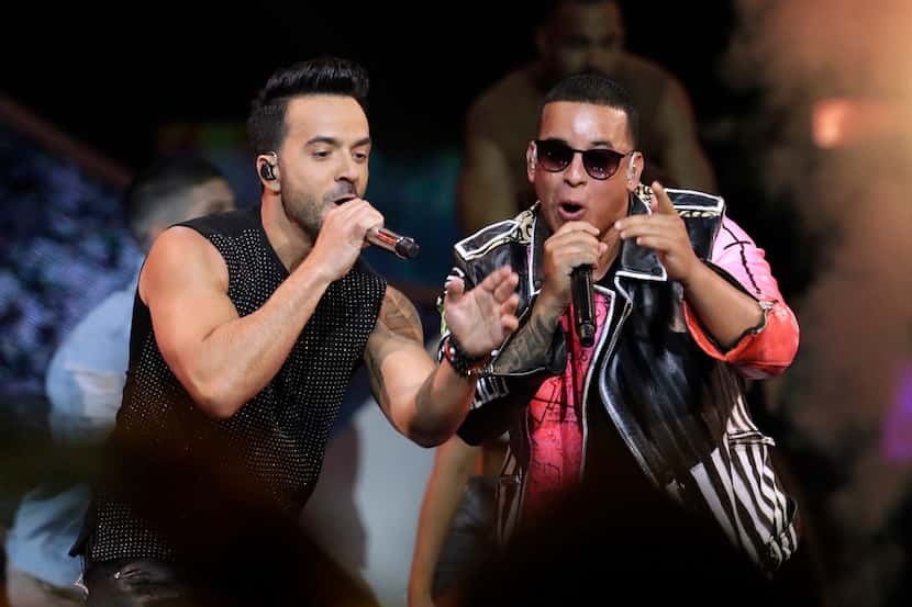 Singers Luis Fonsi, left, and Daddy Yankee perform during the Latin Billboard Awards in...