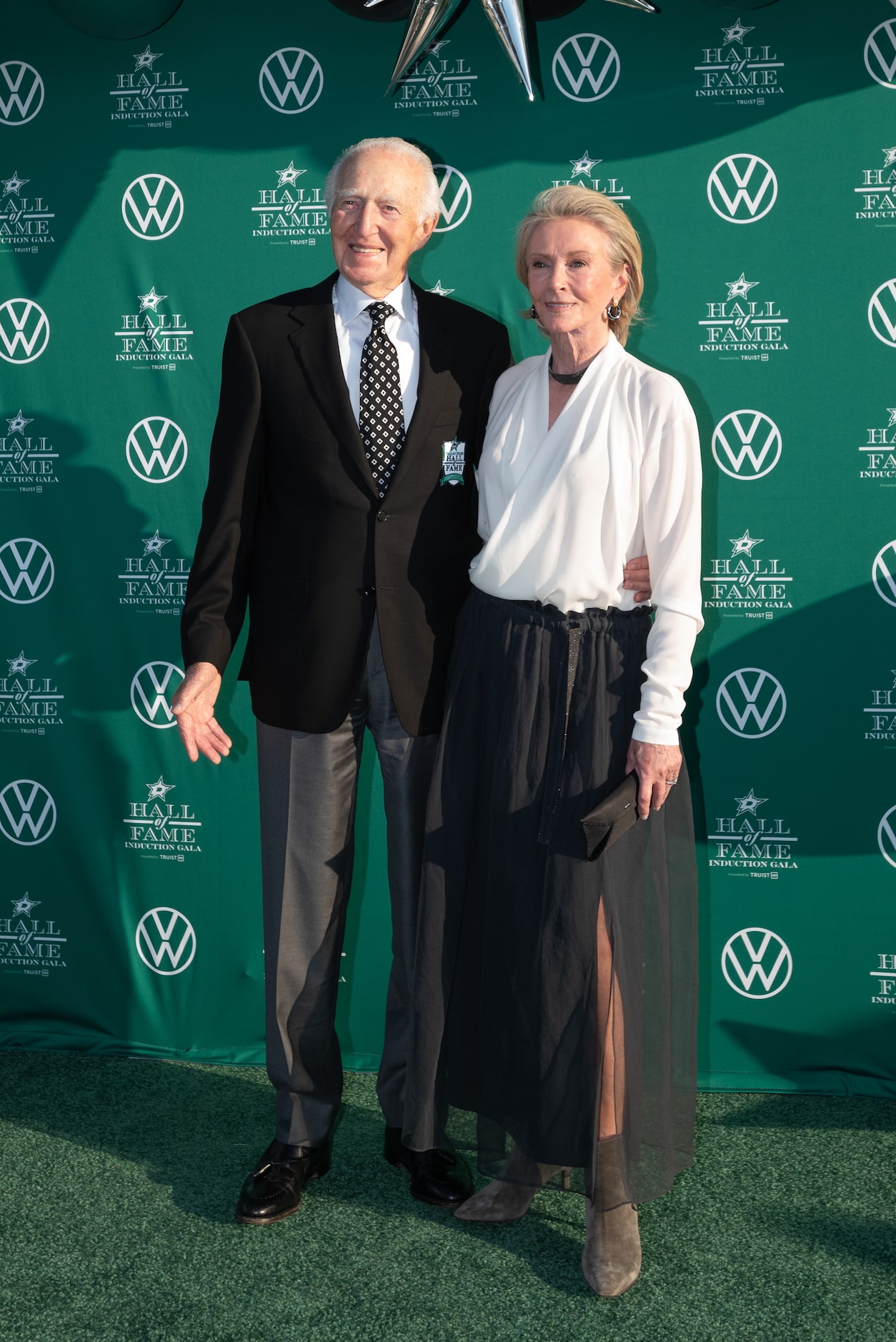 Former owner Norm Green and his wife Kelly Green, pose for photos as they arrive for the...