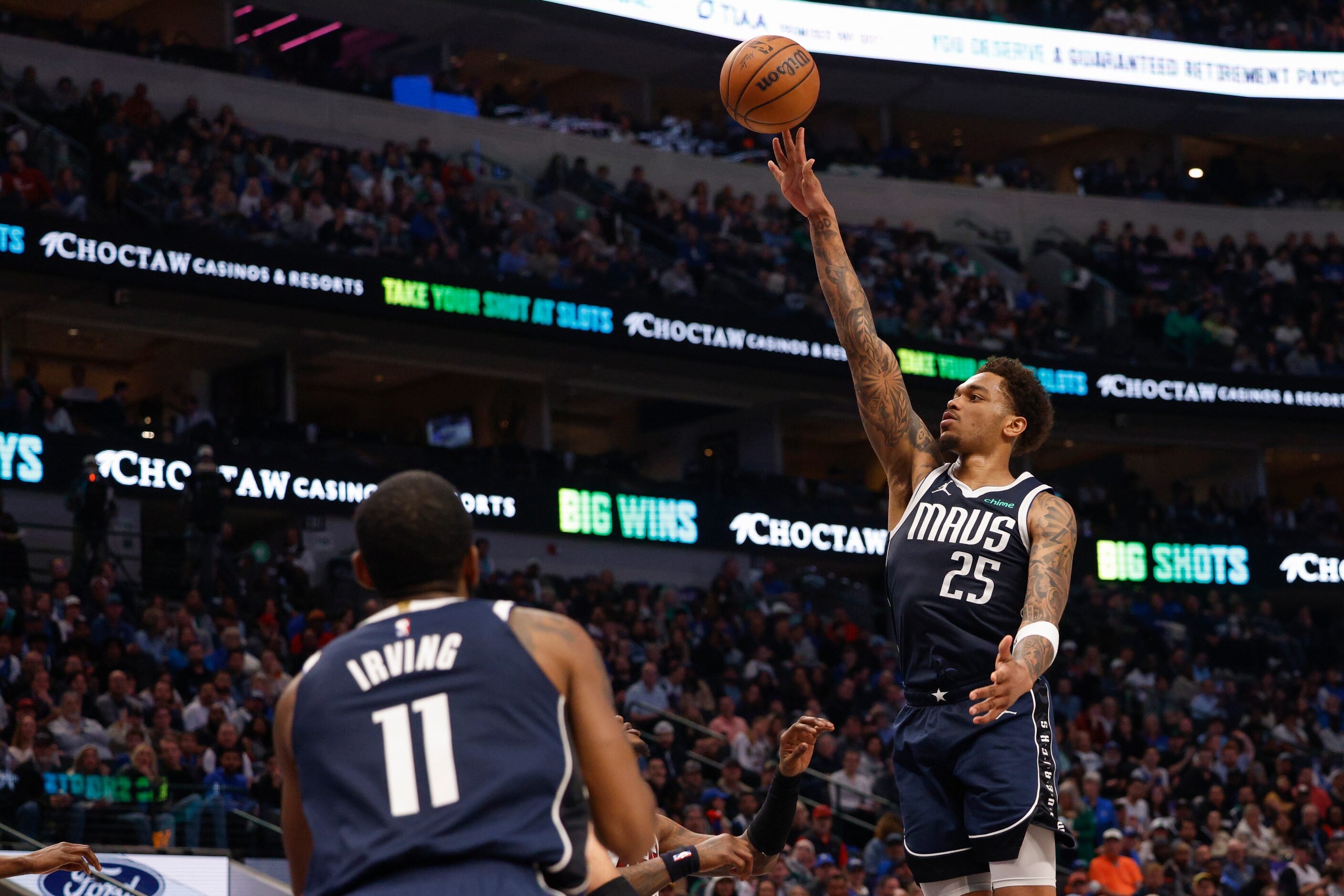 Dallas Mavericks forward P.J. Washington (25) floats a shot during the first half of an NBA...