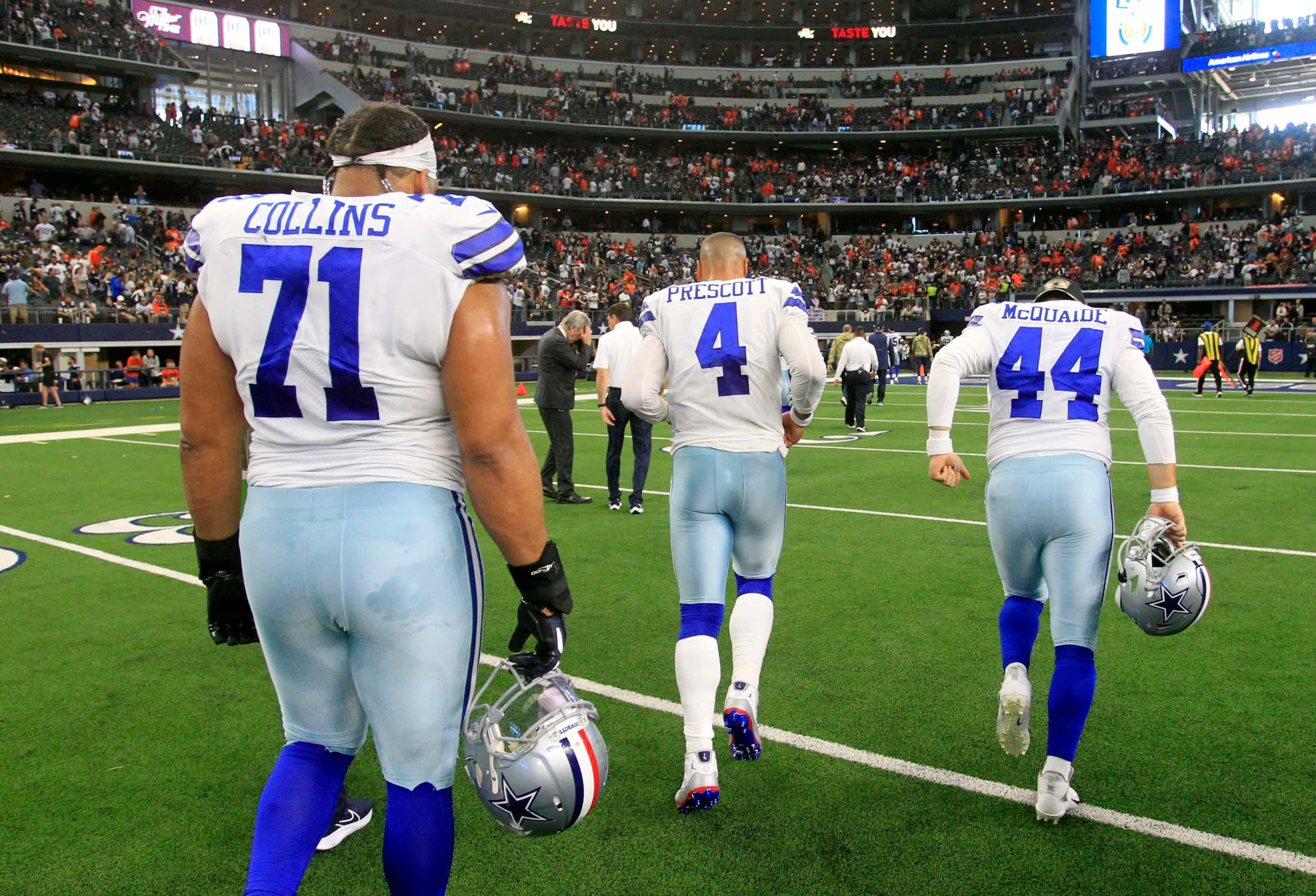 Dallas Cowboys offensive tackle La'el Collins (71), quarterback Dak Prescott (4) long...