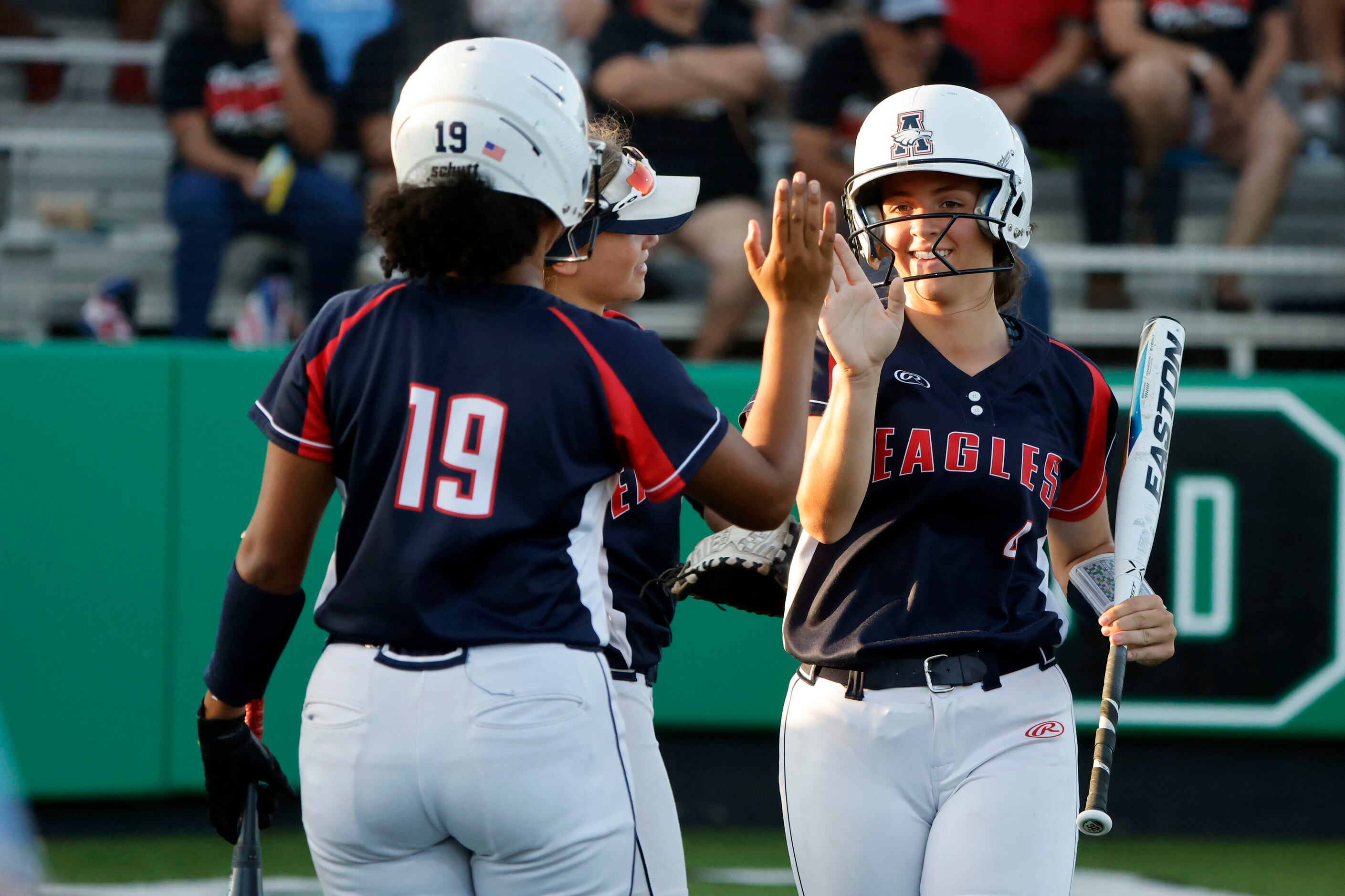 Allen’s Micaela Booth (19) congratulates Sami Hood (4) after she scored against South Grand...