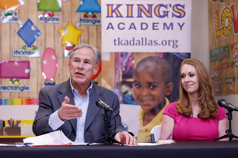 Gov. Greg Abbott speaks alongside Mandy Drogin, campaign manager for Next Generation Texas,...