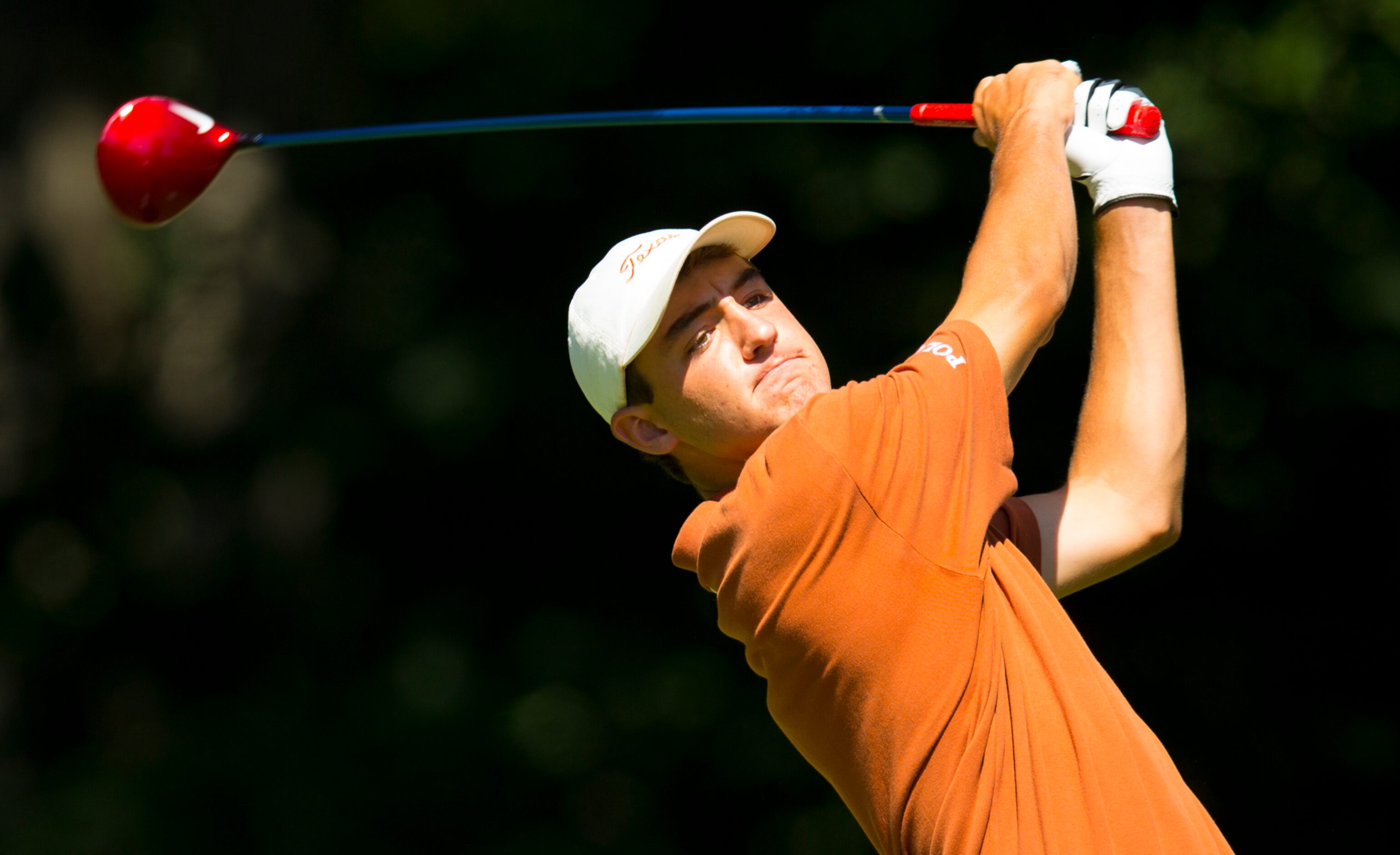 Scottie Scheffler watches his tee shot on the 10th hole during the second round of match...