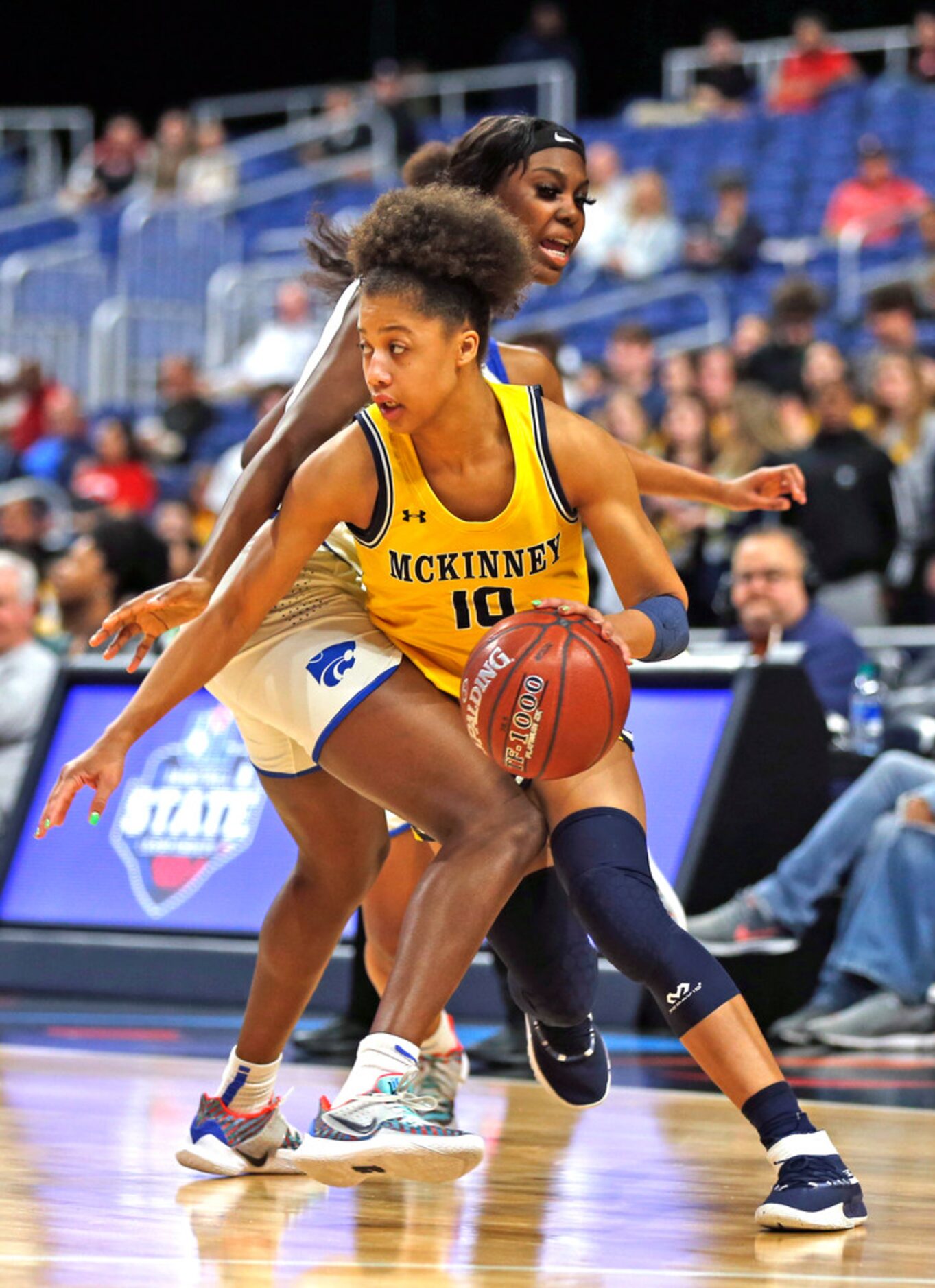 McKinney guard Erin Fry #10 drives on Cypress Creek forward Morgan Hill #5 in a semifinal:...