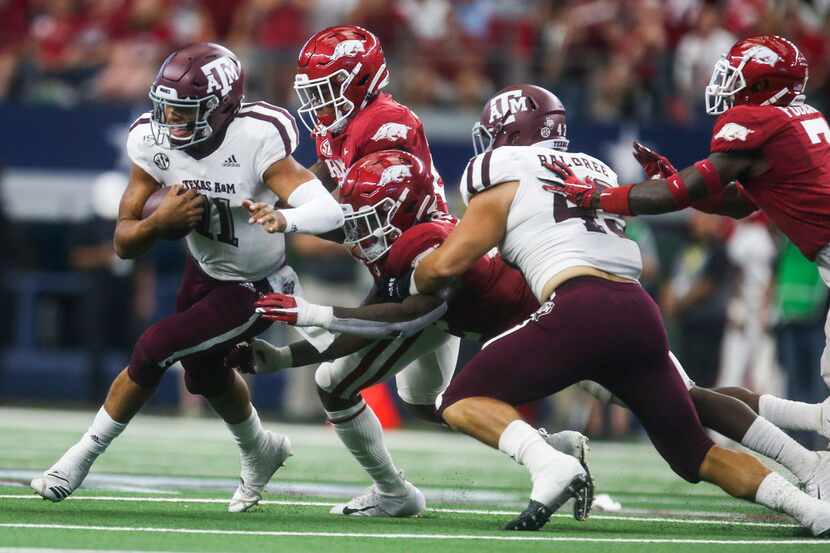 Texas A&M Aggies quarterback Kellen Mond (11) carries the ball during the first half of a...