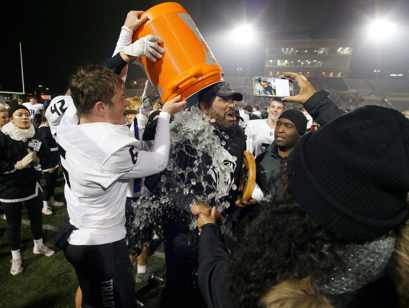 Bishop Lynch Friars headcoach Chuck Faucette gets a bucket of ice by Samuel Vrana (6) during...
