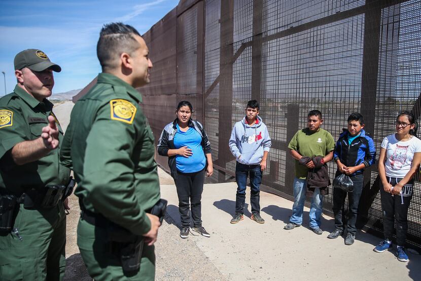 U.S. Border Patrol agents take into custody a group of Central American asylum seekers who...