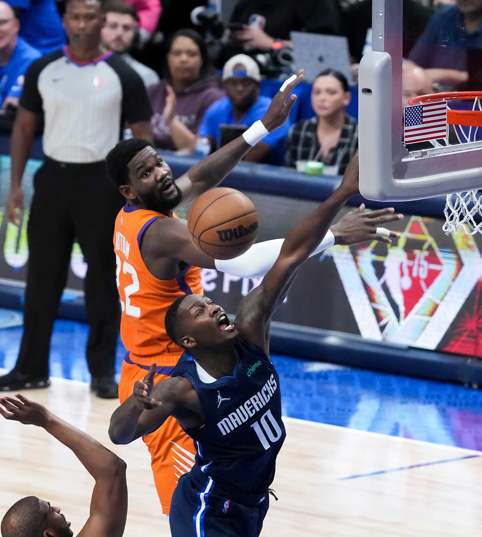 Dallas Mavericks forward Dorian Finney-Smith (10) fights for a a rebound against Phoenix...