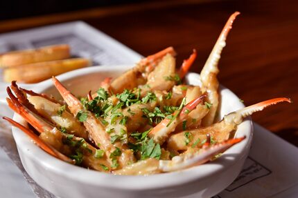 Crab claws in garlic butter are part of the Crab House menu.