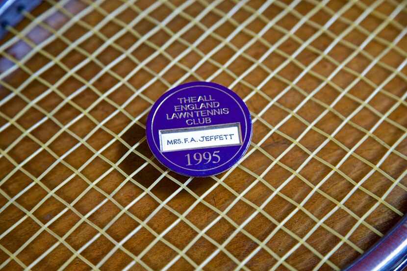 
Nancy Jeffett’s Wimbledon Members pin sits on top of her tennis racket at her home in Dallas. 