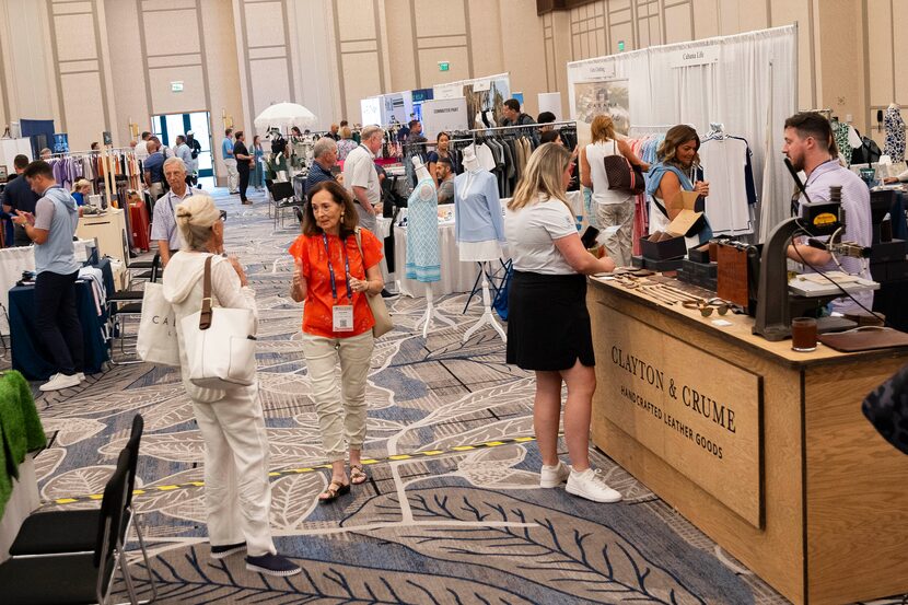 Attendees and exhibitors browse the booths at the PGA Buying and Education Summit.