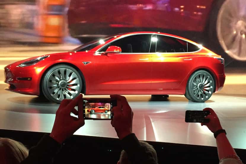 Tesla Motors unveiled the new lower-priced Model 3 sedan at the Tesla Motors design studio...