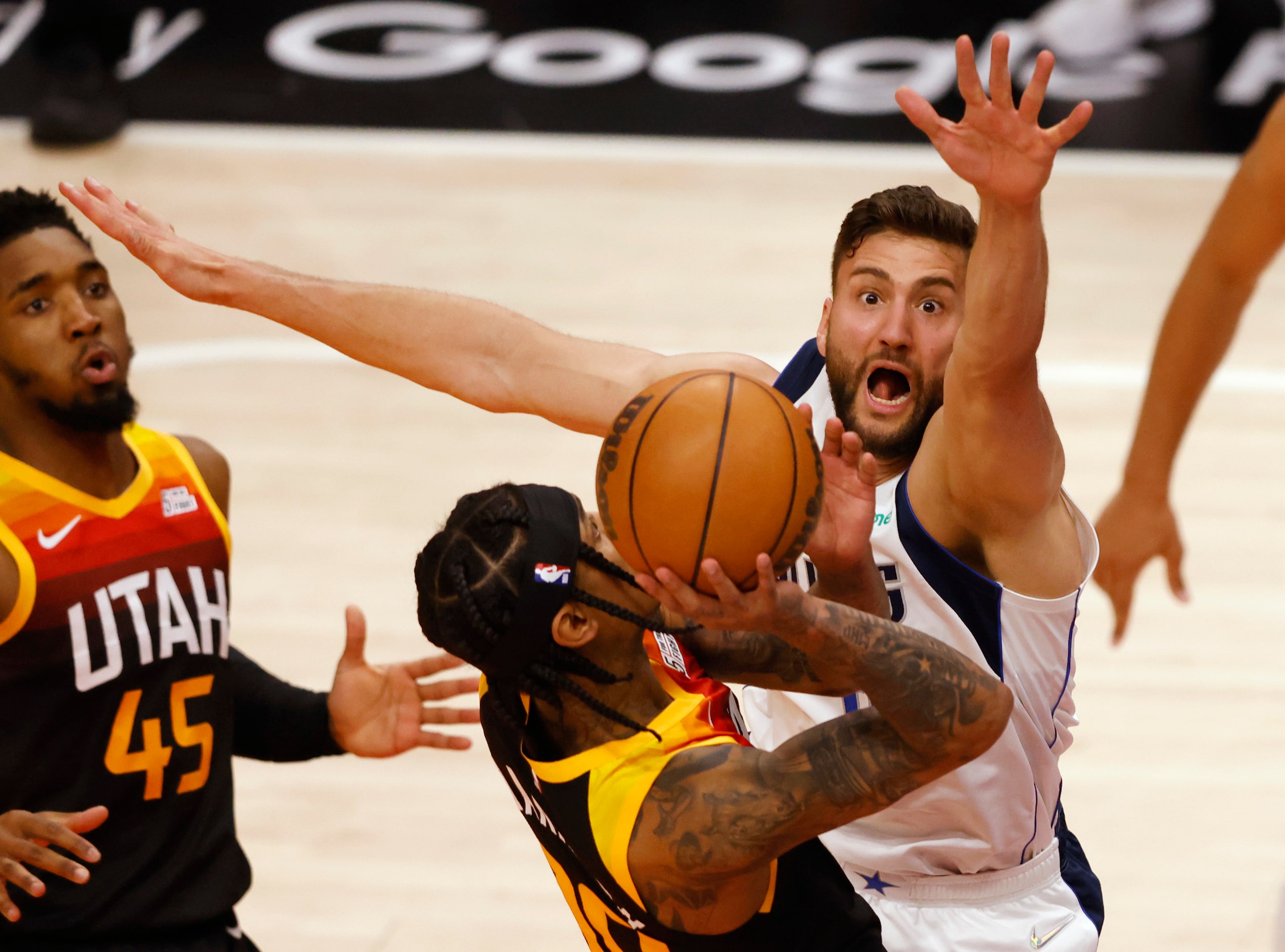 Dallas Mavericks forward Maxi Kleber (42) defends as Utah Jazz guard Jordan Clarkson (00)...