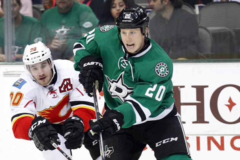 Dallas Stars center Shawn Horcoff (10) battles with Colorado Avalanche right wing Marc-Andre...