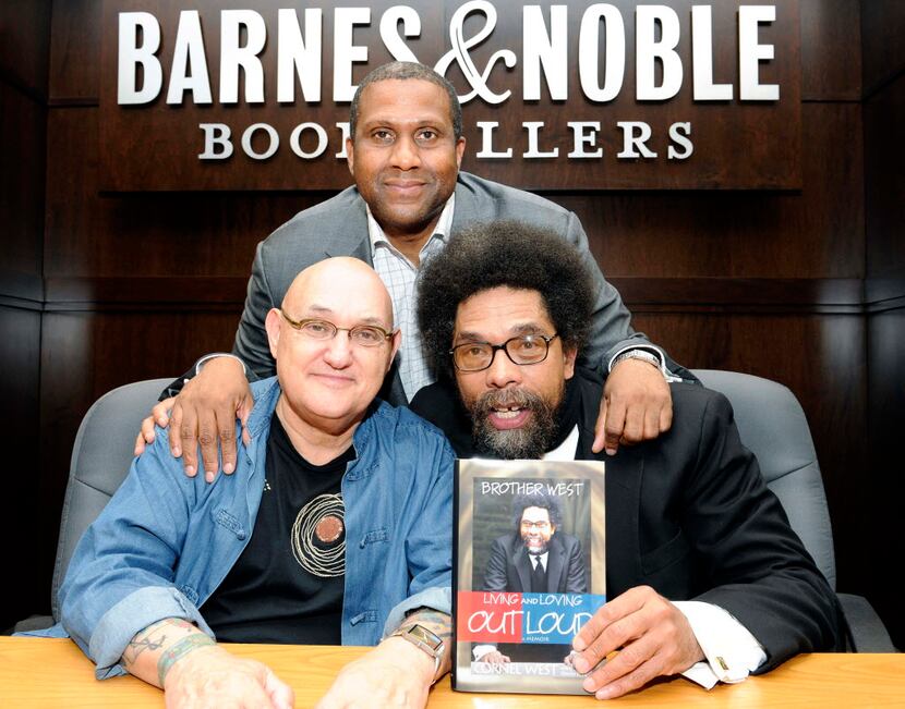 Biographer David Ritz, left, Tavis Smiley, top, and Dr. Cornel West are in attendance at the...