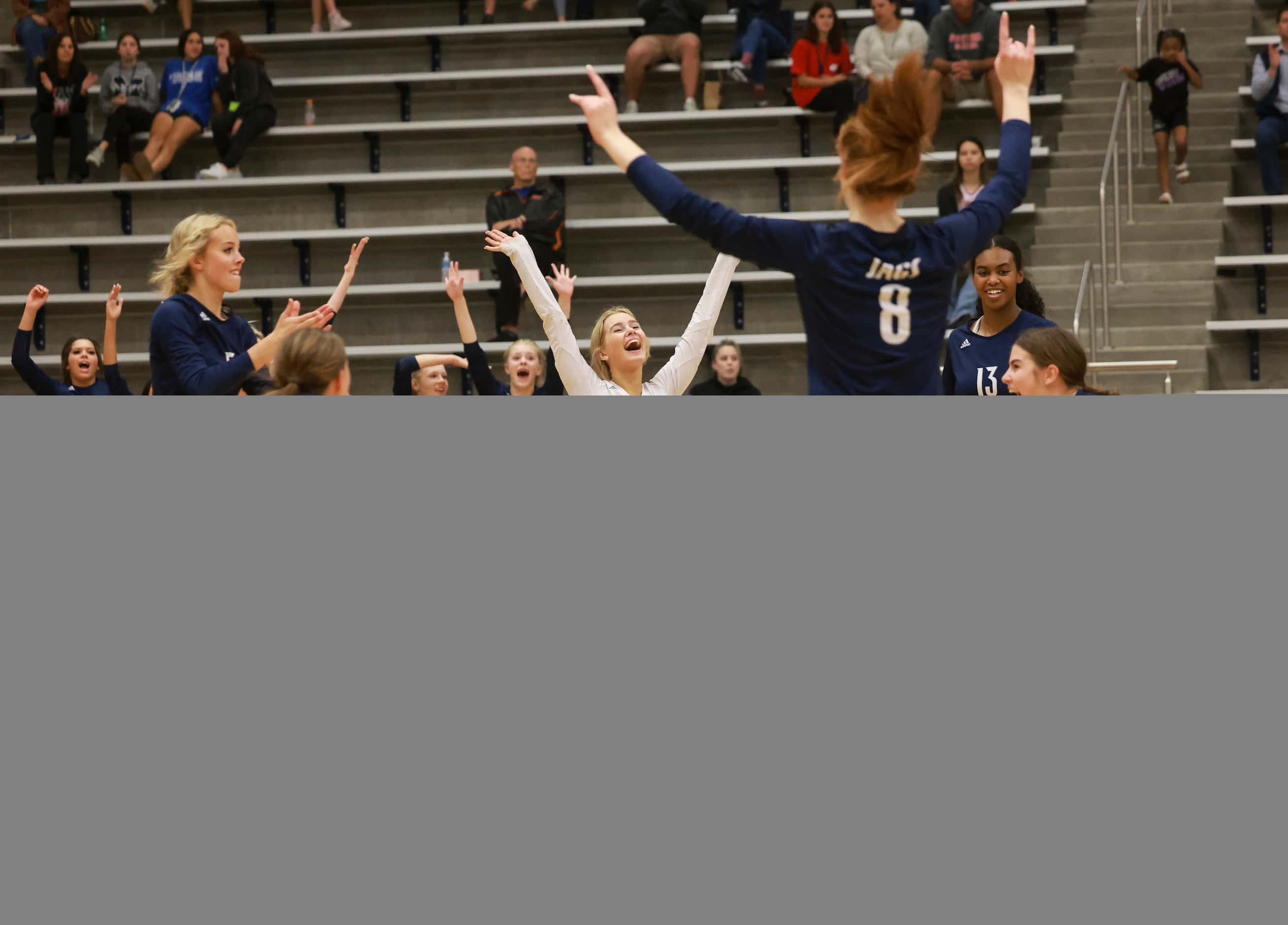 Flower Mound High School Emerson Dement (1) cheers as Flower Mound ties up the volleyball...
