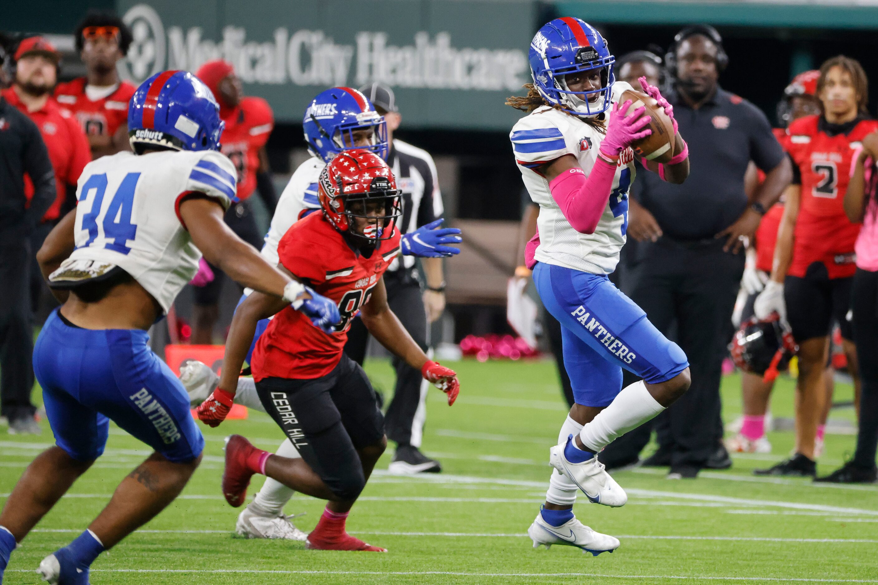 Duncaville’s Deldrick Madison (4) makes an interception in front of Cedar Hill receiver...