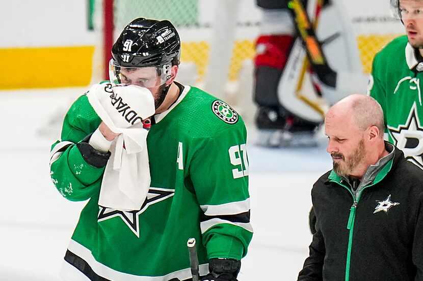 Dallas Stars center Tyler Seguin (91) leaves the ice after he was injured on a roughing...