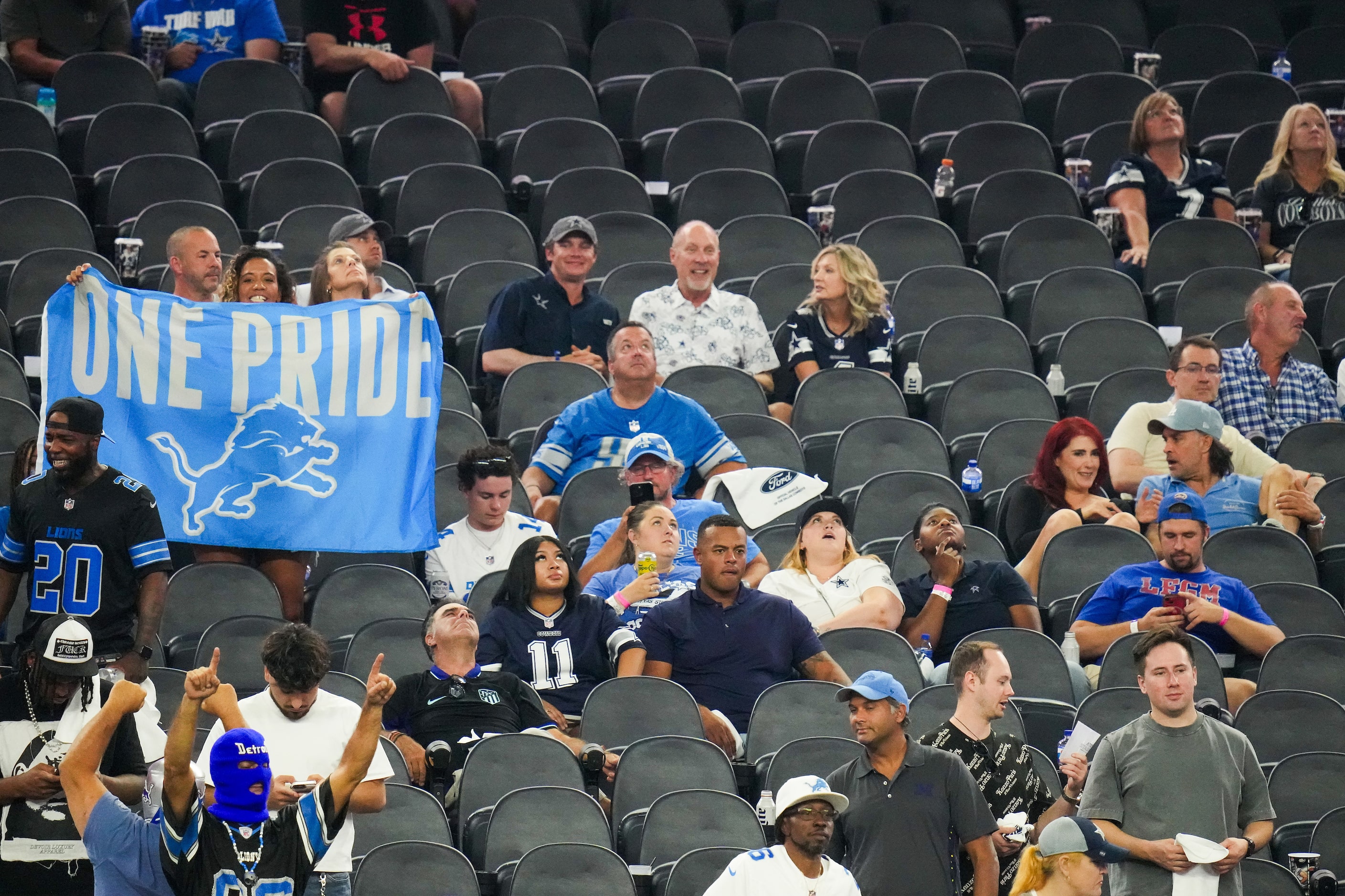 Detroit Lions fans celebrate a Dallas Cowboys turnover long after most of the Cowboys fans...