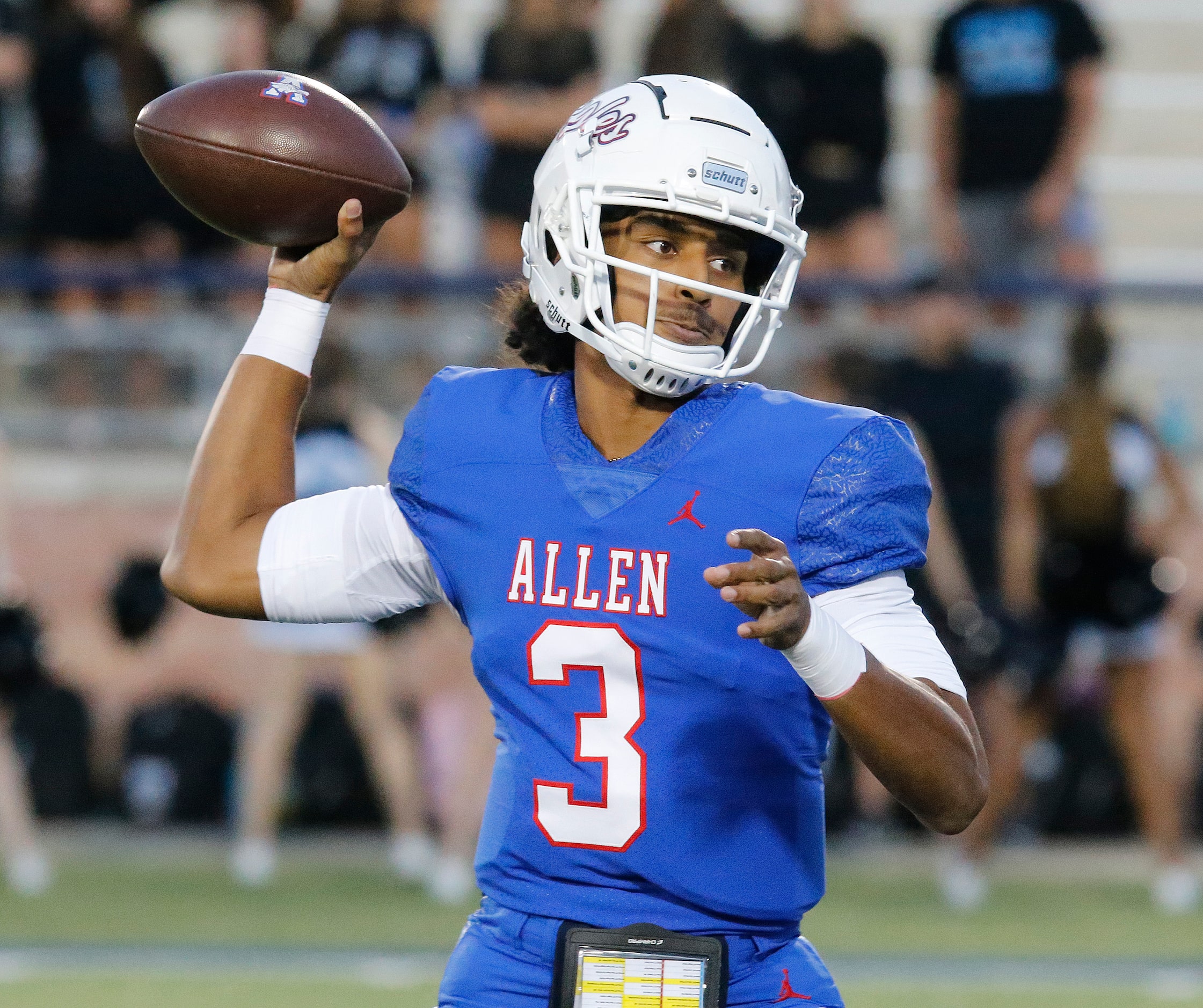 Allen High School quarterback Mike Hawkins (3) throws a pass during the first half as Allen...